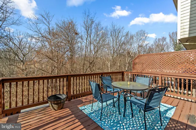 a view of a chairs and table on the deck