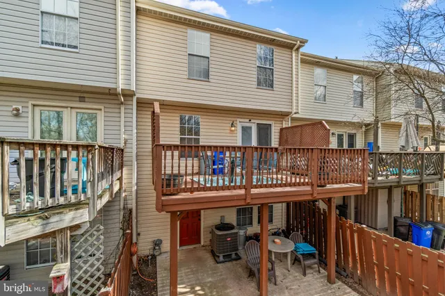 a yellow house with outdoor seating space