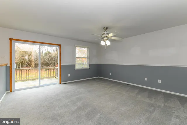 a kitchen with stainless steel appliances granite countertop a refrigerator a stove and a sink with granite countertops