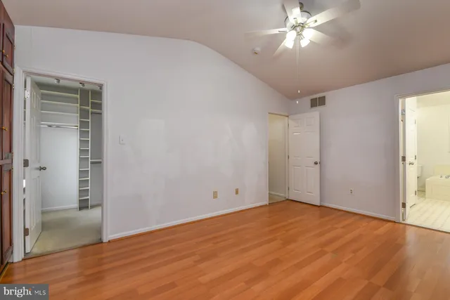 a bathroom with a granite countertop sink mirror and a bathtub