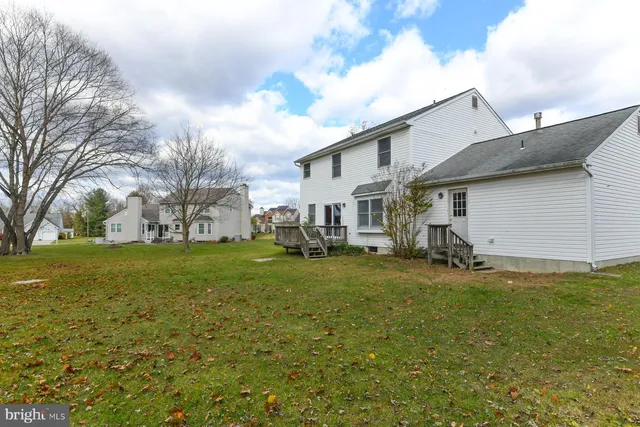 a house with trees in the background
