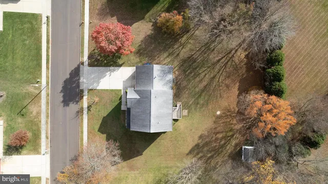 a aerial view of a house with swimming pool and lake view