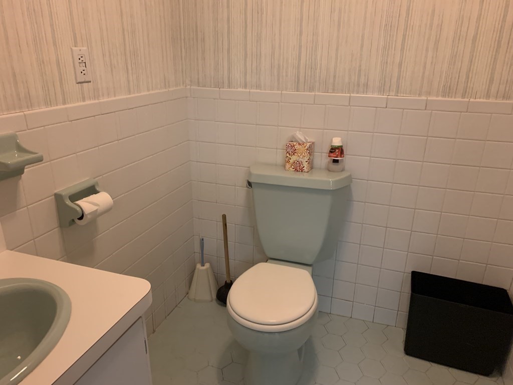 790 Broadway Everett, MA 02149 - Photo 15 of 39 a bathroom with a toilet and a sink