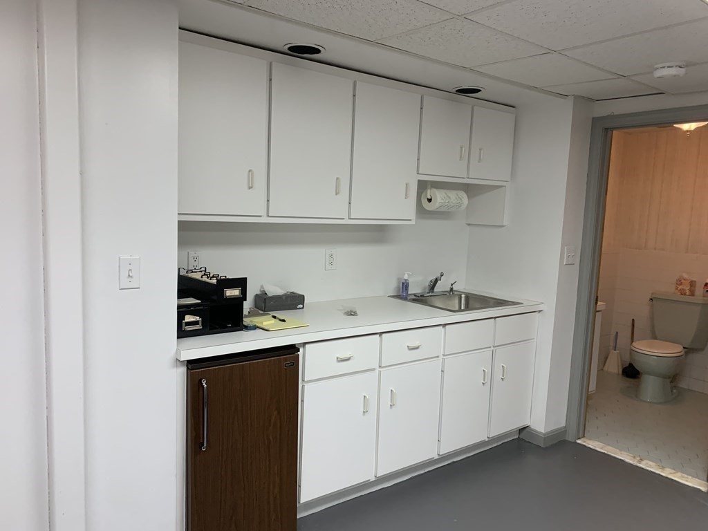 790 Broadway Everett, MA 02149 - Photo 16 of 39 a kitchen with a sink and cabinets
