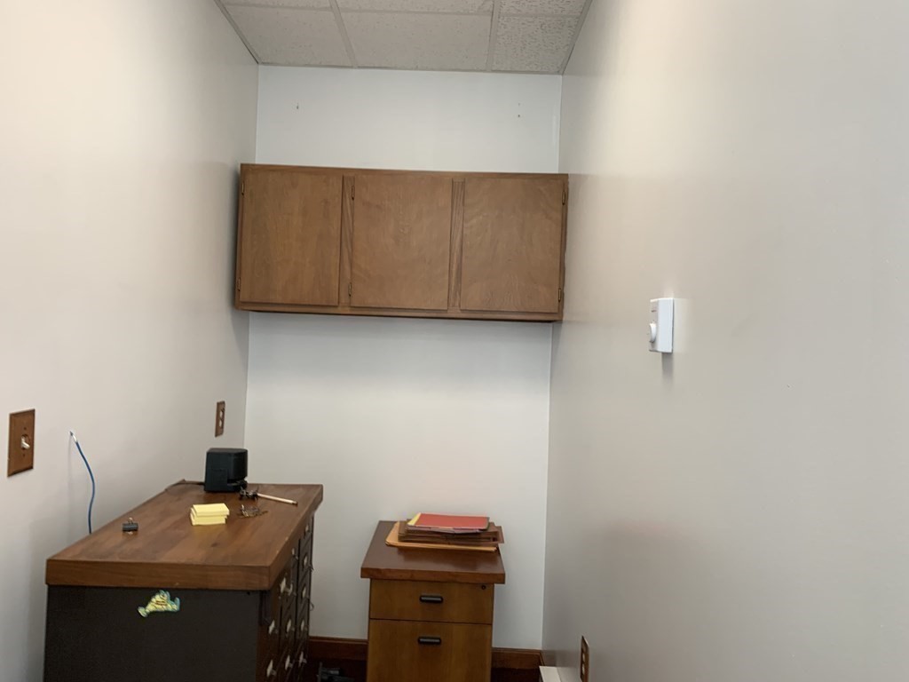 790 Broadway Everett, MA 02149 - Photo 20 of 39 a room with a desk and a lamp on dresser