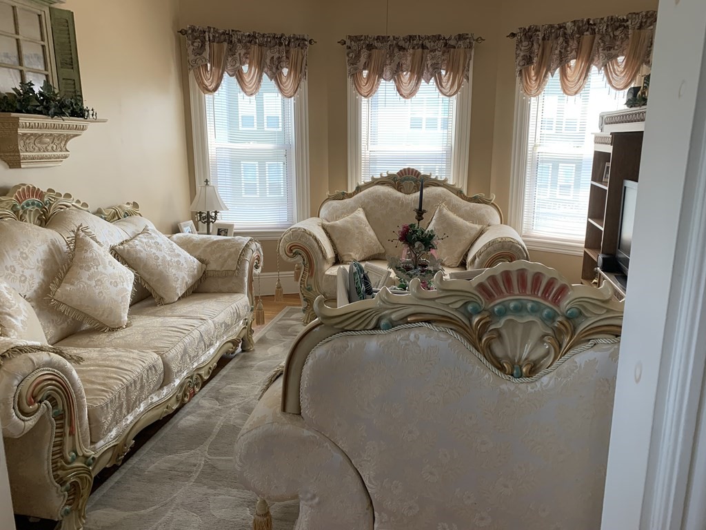 790 Broadway Everett, MA 02149 - Photo 29 of 39 a living room with furniture and a large window