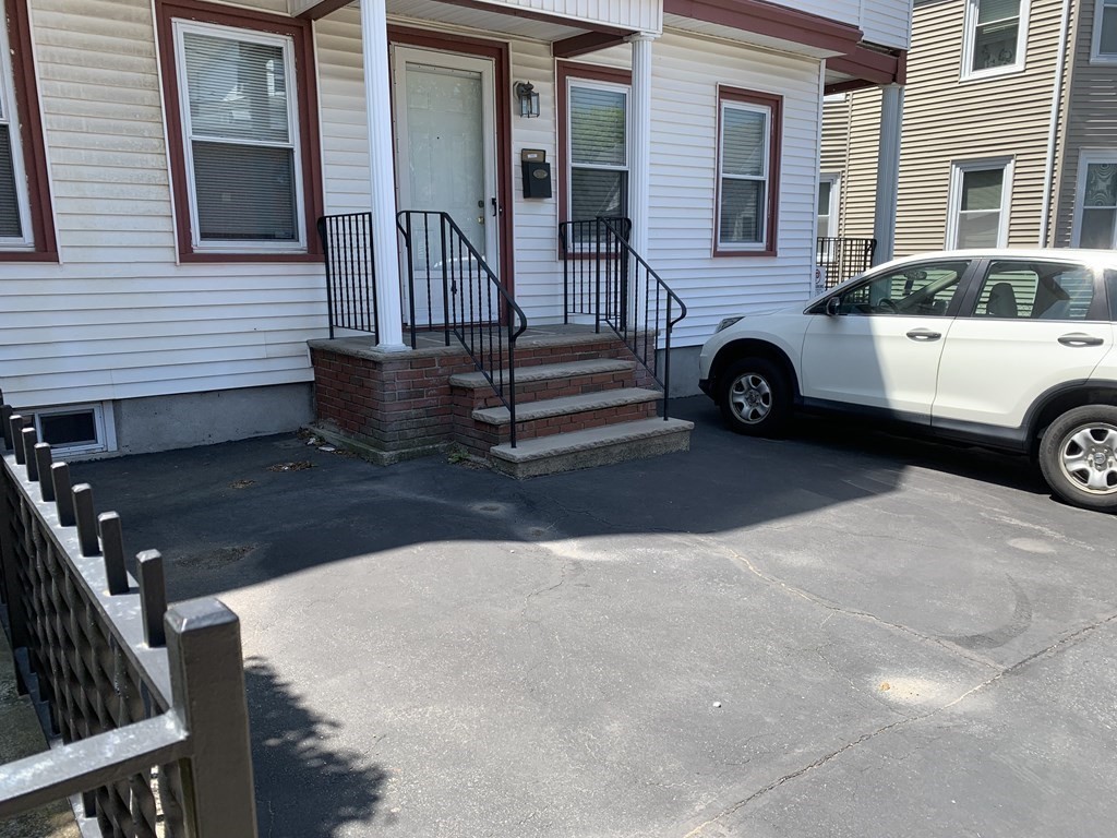 790 Broadway Everett, MA 02149 - Photo 3 of 39 a view of a car park in front of a house