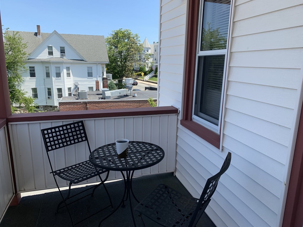 790 Broadway Everett, MA 02149 - Photo 31 of 39 a view of a chairs and table in the balcony