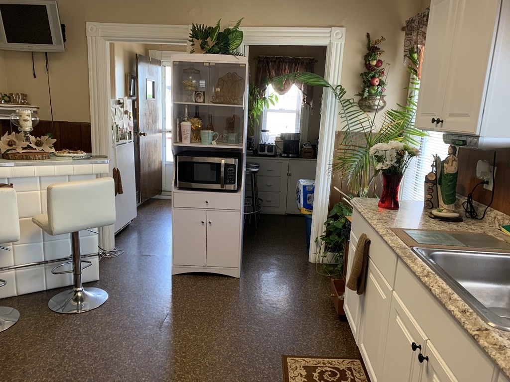 790 Broadway Everett, MA 02149 - Photo 39 of 39 a kitchen with a sink stove and refrigerator
