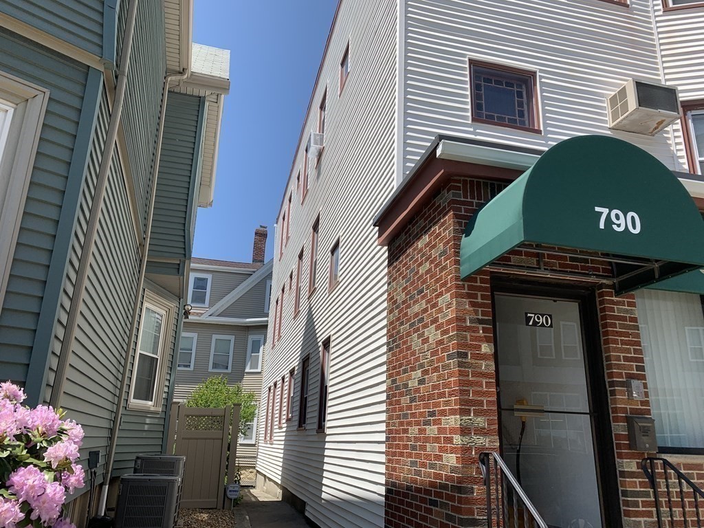 790 Broadway Everett, MA 02149 - Photo 7 of 39 a front view of a house with a garden