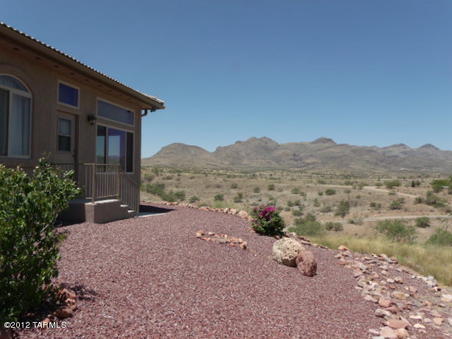 1490 Circulo Jacona Rio Rico, AZ 85648 - Photo 27 of 29 a view of a house with a yard and a large window