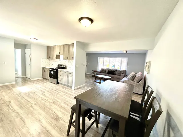 a view of a dining room with furniture and a livingroom