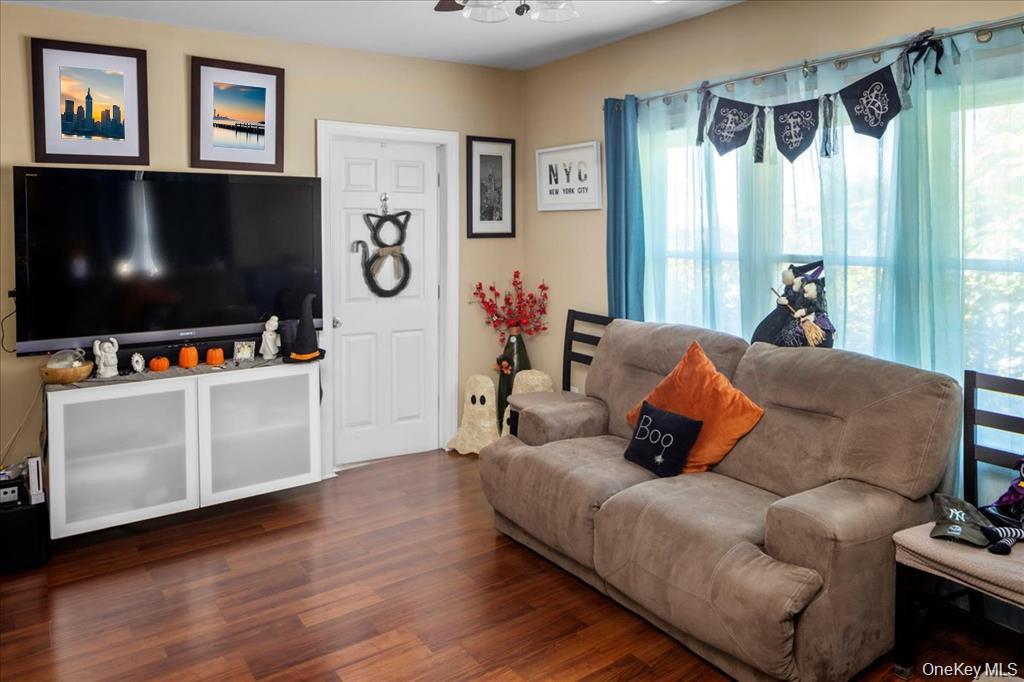 196-33 Foothill Avenue Queens, NY 11423 - Photo 18 of 34 a living room with furniture and a flat screen tv