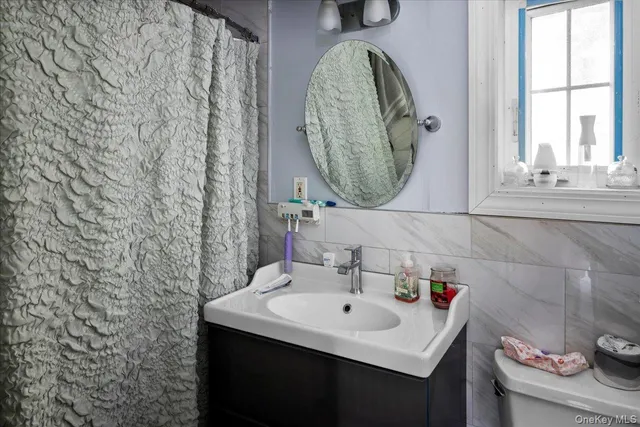 a bedroom with a bed and cabinets