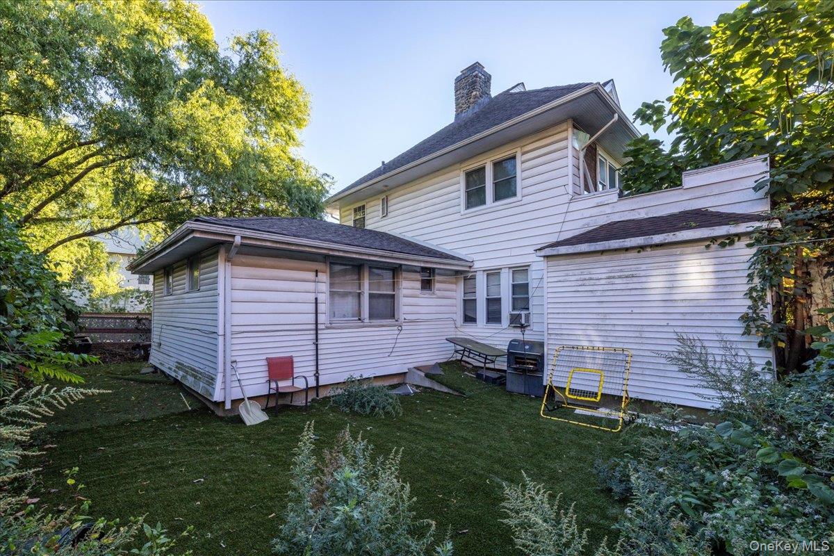196-33 Foothill Avenue Queens, NY 11423 - Photo 22 of 34 a backyard of a house with lots of green space