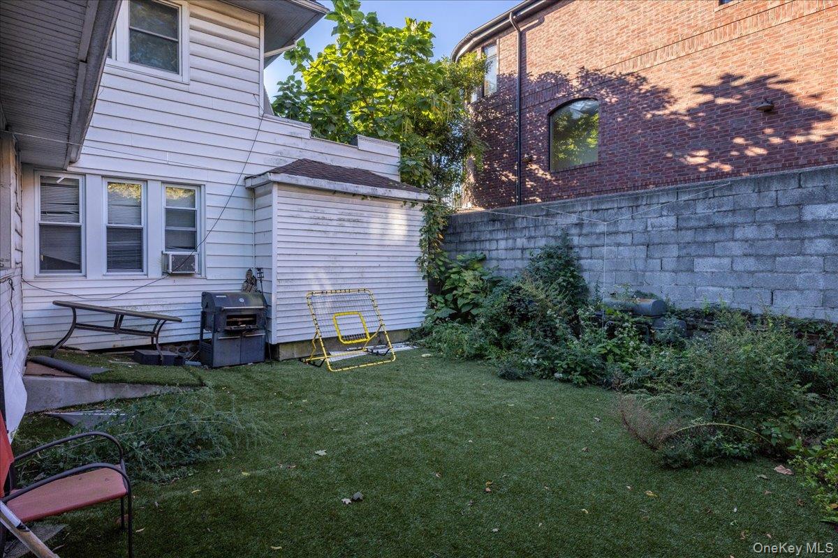 196-33 Foothill Avenue Queens, NY 11423 - Photo 23 of 34 a backyard of a house with lots of green space