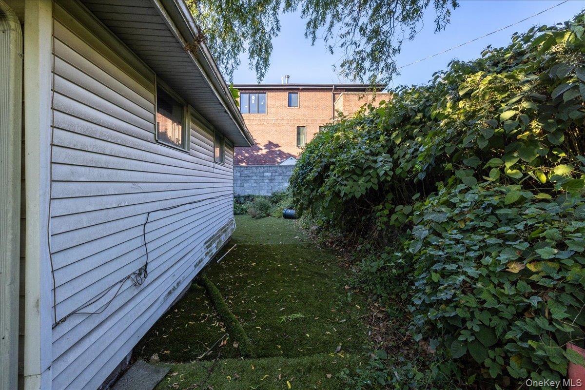 196-33 Foothill Avenue Queens, NY 11423 - Photo 24 of 34 a view of a backyard with pathway