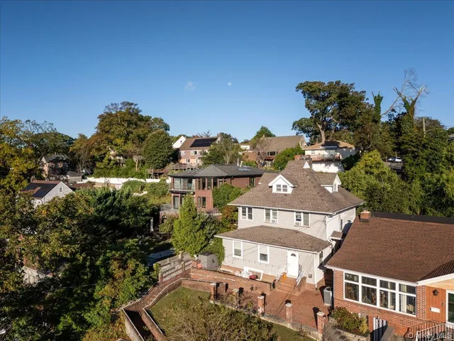 an aerial view of a house with a ocean view