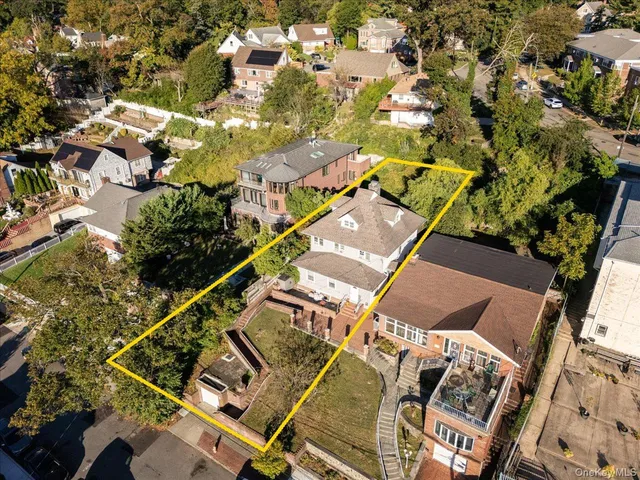 an aerial view of a residential apartment building with a yard