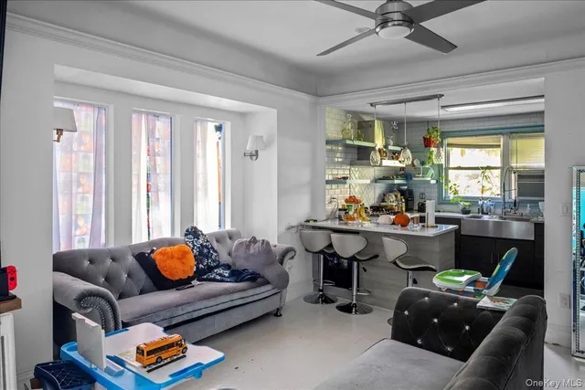 a living room with furniture and a window