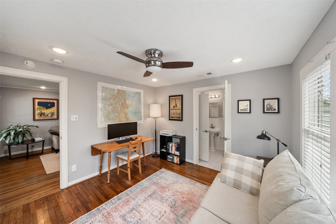 1510 Alexander Street Houston, TX 77008 - Photo 11 of 18 Second bedroom currently serving as home office and sitting room — with its own private en-suite bath. The bungalow that lives bigger than its square footage.