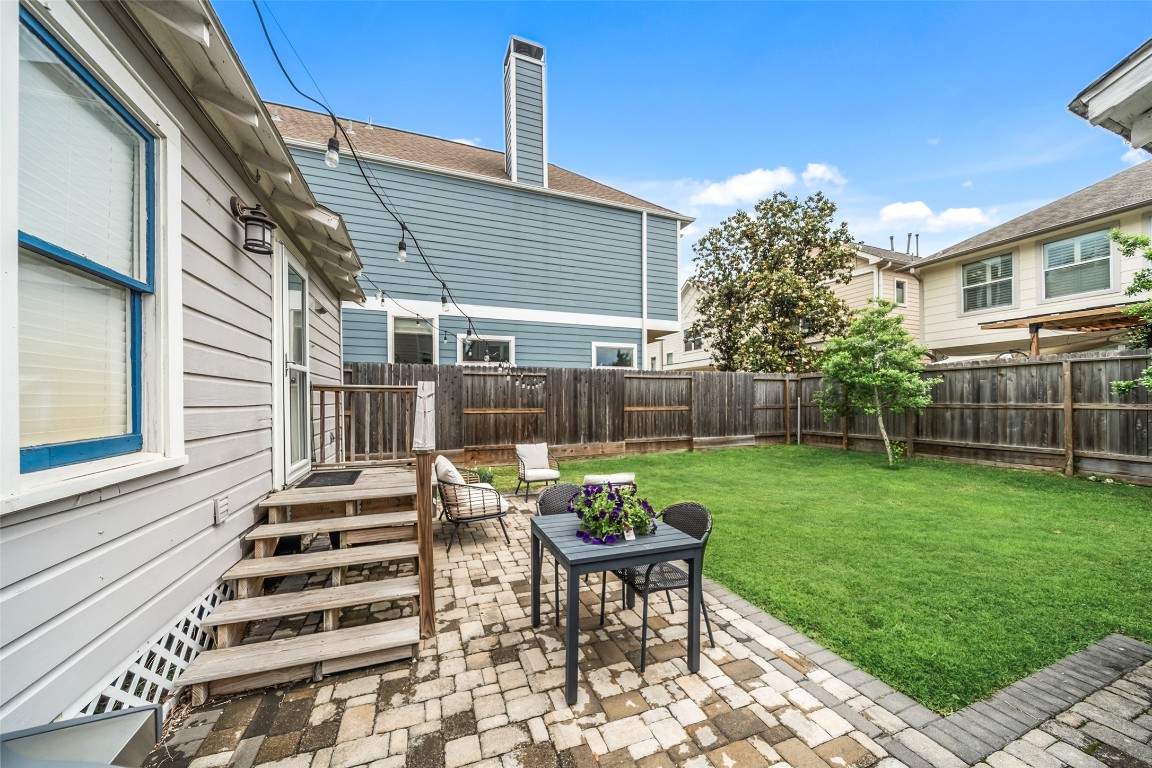 1510 Alexander Street Houston, TX 77008 - Photo 14 of 18 Brick paver patio, string lights, privacy fence, and a fully fenced backyard with room to breathe. In the inner loop. At this price. Yes, really.