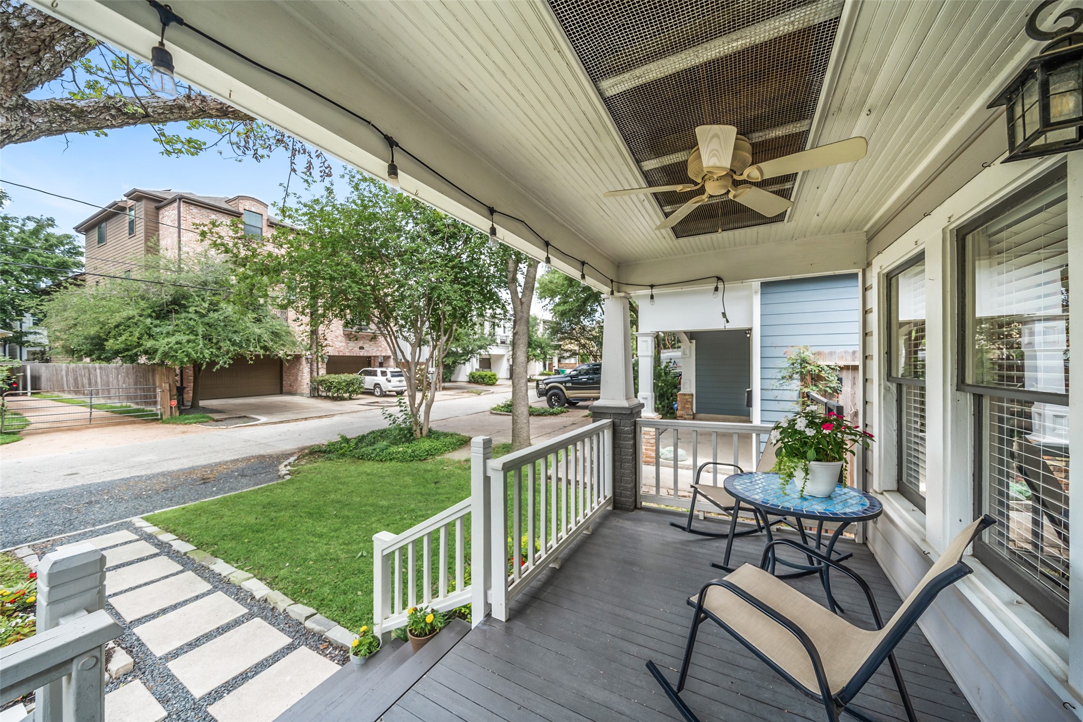 1510 Alexander Street Houston, TX 77008 - Photo 3 of 18 Beadboard ceiling, ceiling fan, string lights, and a brick column porch big enough for a bistro table and a long afternoon. This is why people move to the Heights.