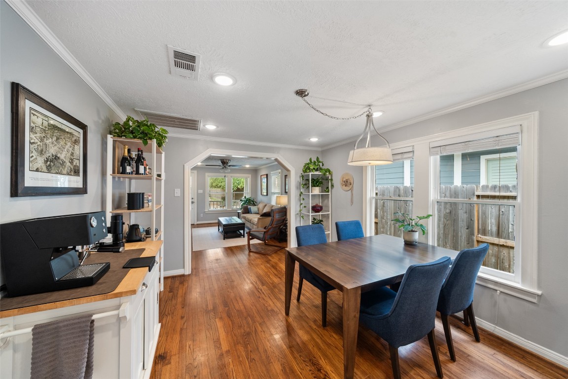 1510 Alexander Street Houston, TX 77008 - Photo 5 of 18 A framed vintage aerial of the Heights neighborhood watches over the dining room. Somebody loved this house enough to study its history.
