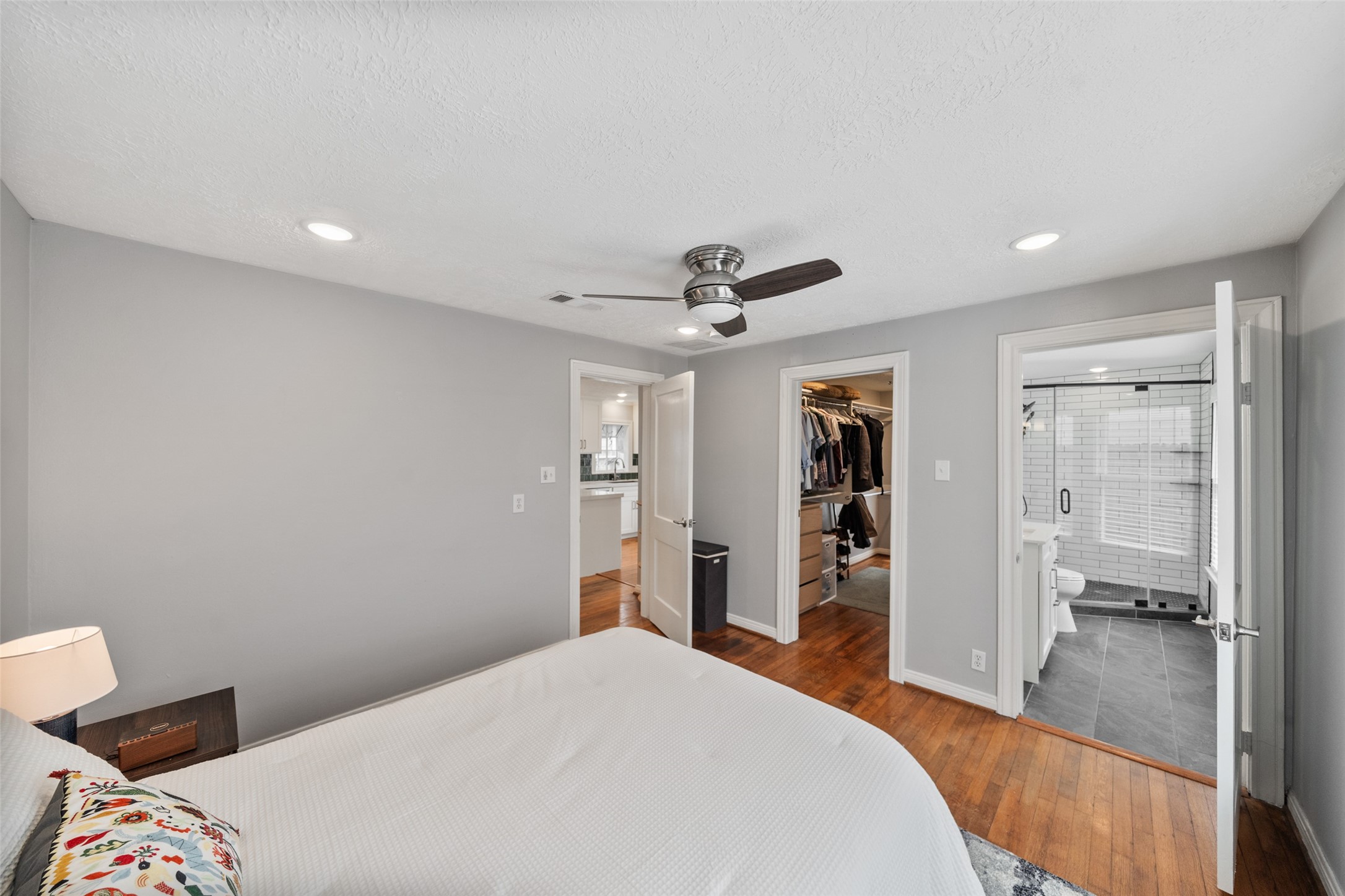 1510 Alexander Street Houston, TX 77008 - Photo 9 of 18 a bedroom with a bed and a chandelier