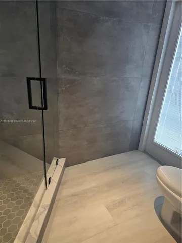 a bathroom with a bathtub and toilet