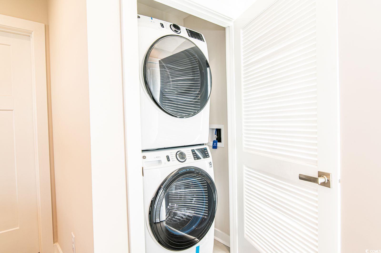 2812 Rowyn Street Longs, SC 29568 - Photo 12 of 27 Washroom featuring estacked washer and dryer