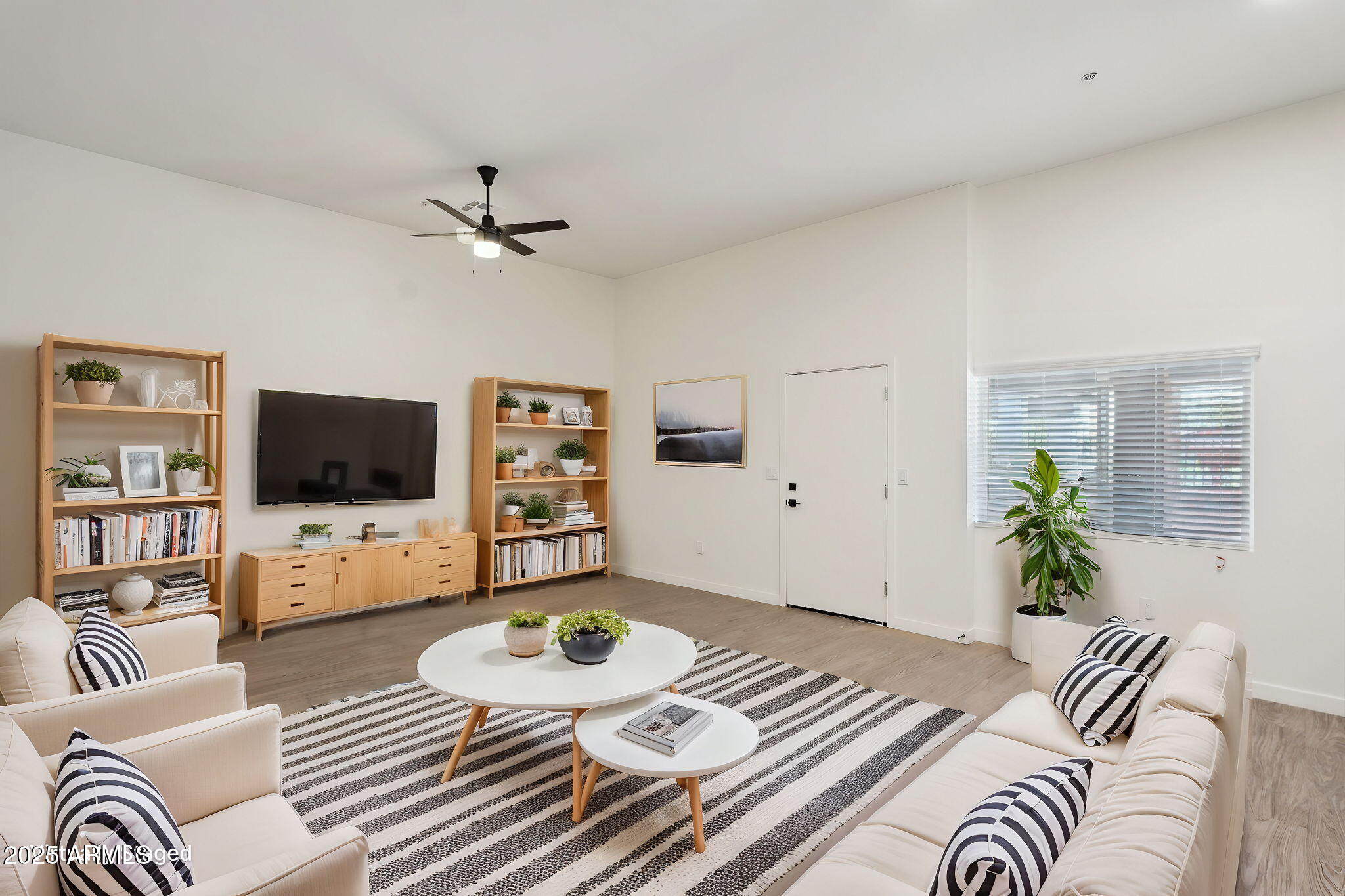 a living room with furniture flat screen tv and a fireplace