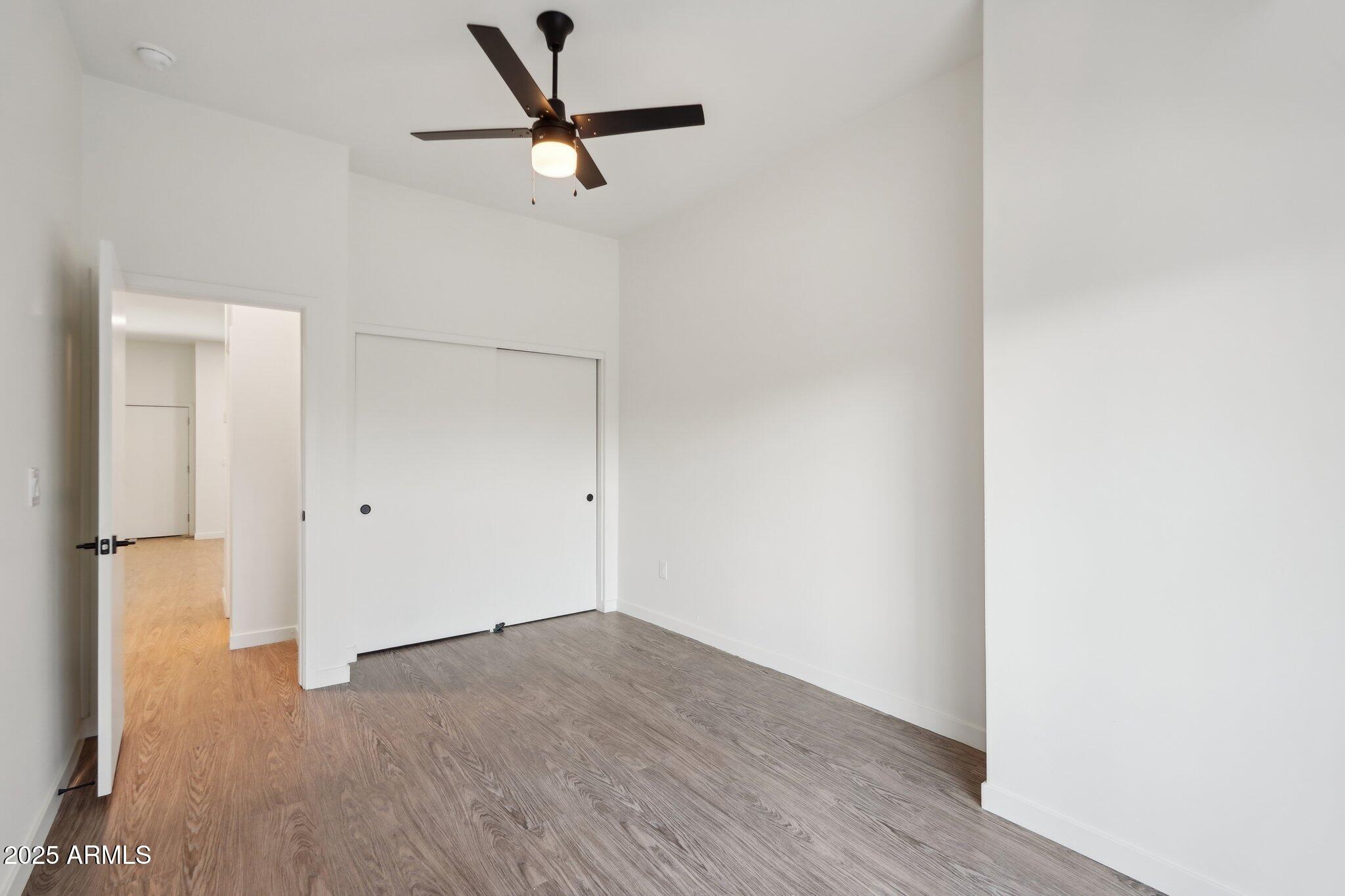 3031 West Northern Avenue, Unit 108 Phoenix, AZ 85051 - Photo 12 of 18 a view of a room with wooden floor