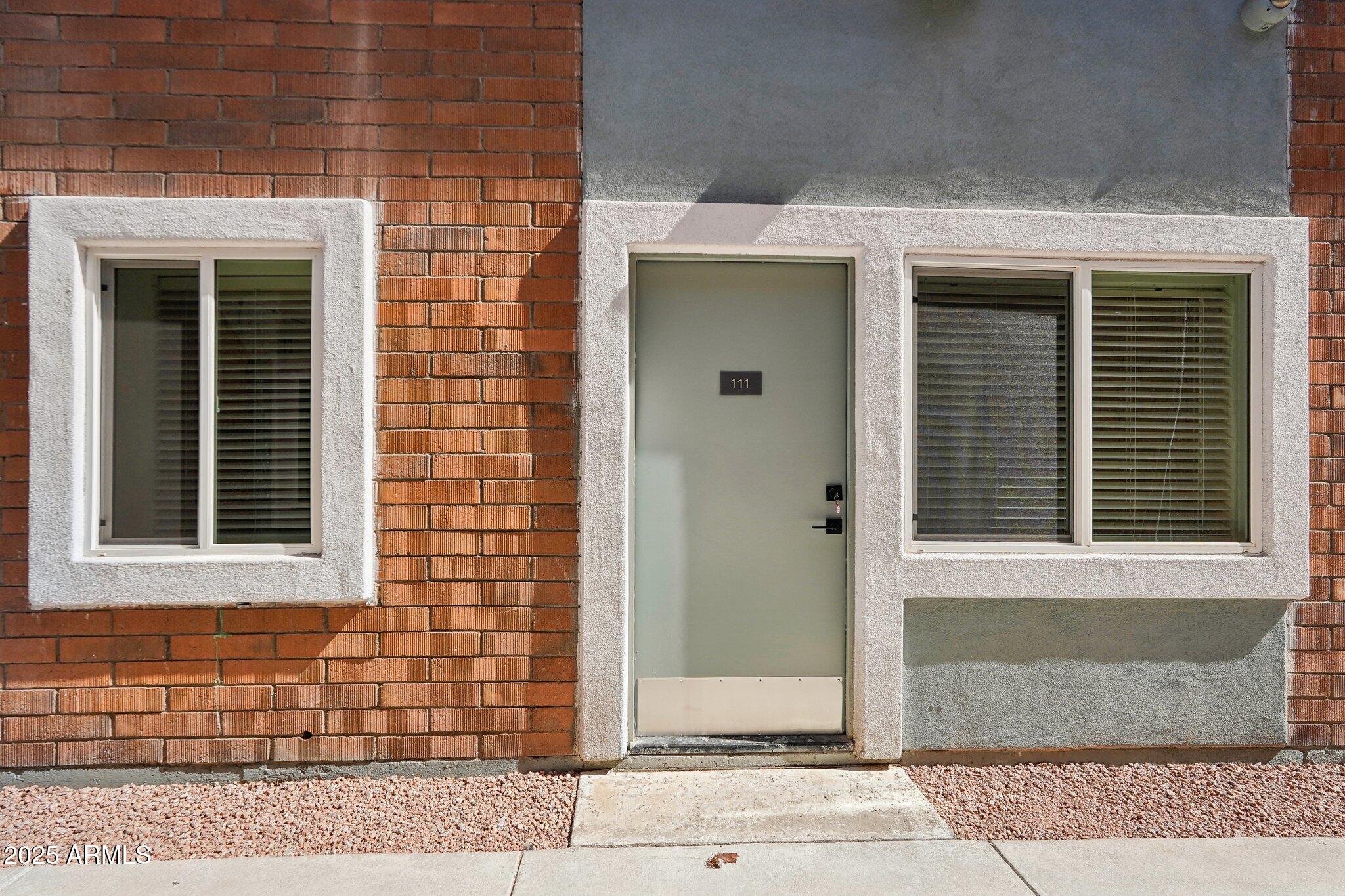 3031 West Northern Avenue, Unit 108 Phoenix, AZ 85051 - Photo 16 of 18 a front view of a house with a window
