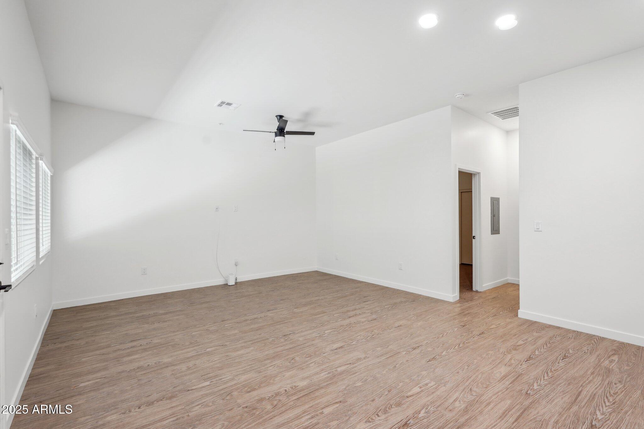 3031 West Northern Avenue, Unit 108 Phoenix, AZ 85051 - Photo 6 of 18 an empty room with a empty space and windows