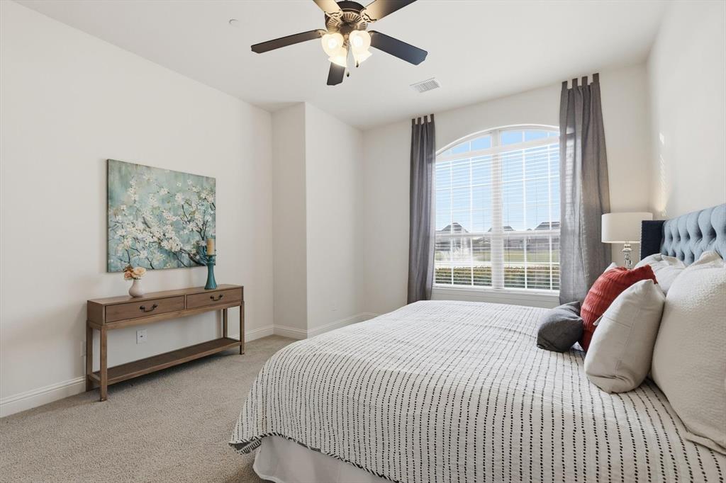 4642 Rhett Lane, Unit B Carrollton, TX 75010 - Photo 19 of 26 Bedroom with carpet floors and ceiling fan