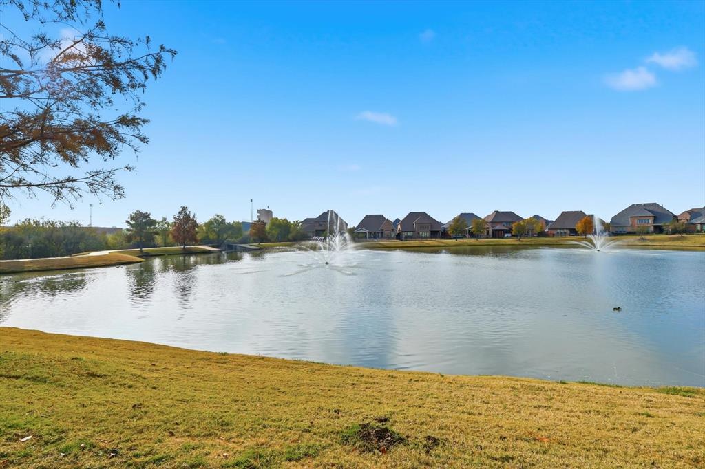 4642 Rhett Lane, Unit B Carrollton, TX 75010 - Photo 2 of 26 Water view with nearby suburban area
