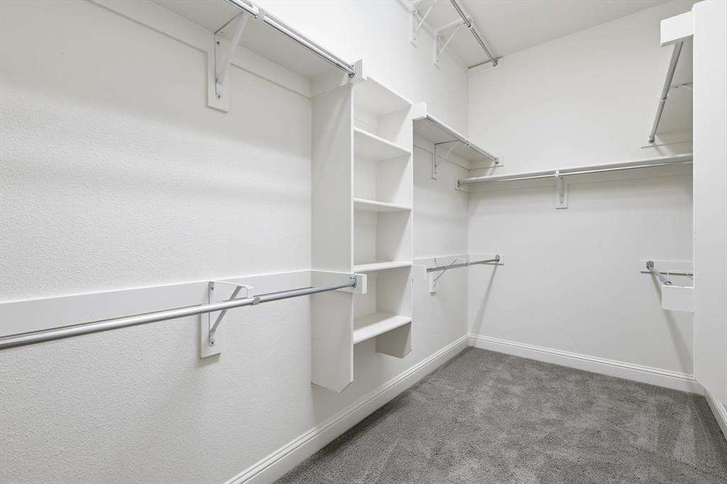 4642 Rhett Lane, Unit B Carrollton, TX 75010 - Photo 23 of 26 Spacious closet with light colored carpet