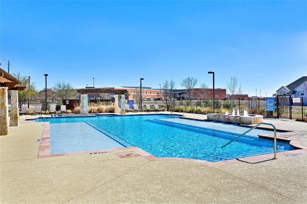 4642 Rhett Lane, Unit B Carrollton, TX 75010 - Photo 24 of 26 Community pool with a patio area and a pergola