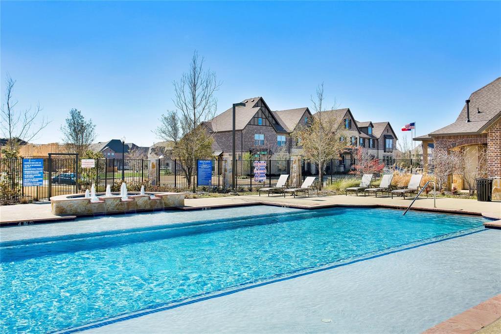 4642 Rhett Lane, Unit B Carrollton, TX 75010 - Photo 25 of 26 Community pool featuring a patio area and a residential view