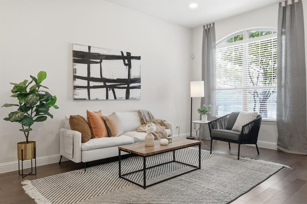 4642 Rhett Lane, Unit B Carrollton, TX 75010 - Photo 8 of 26 Living area featuring hardwood / wood-style flooring and baseboards