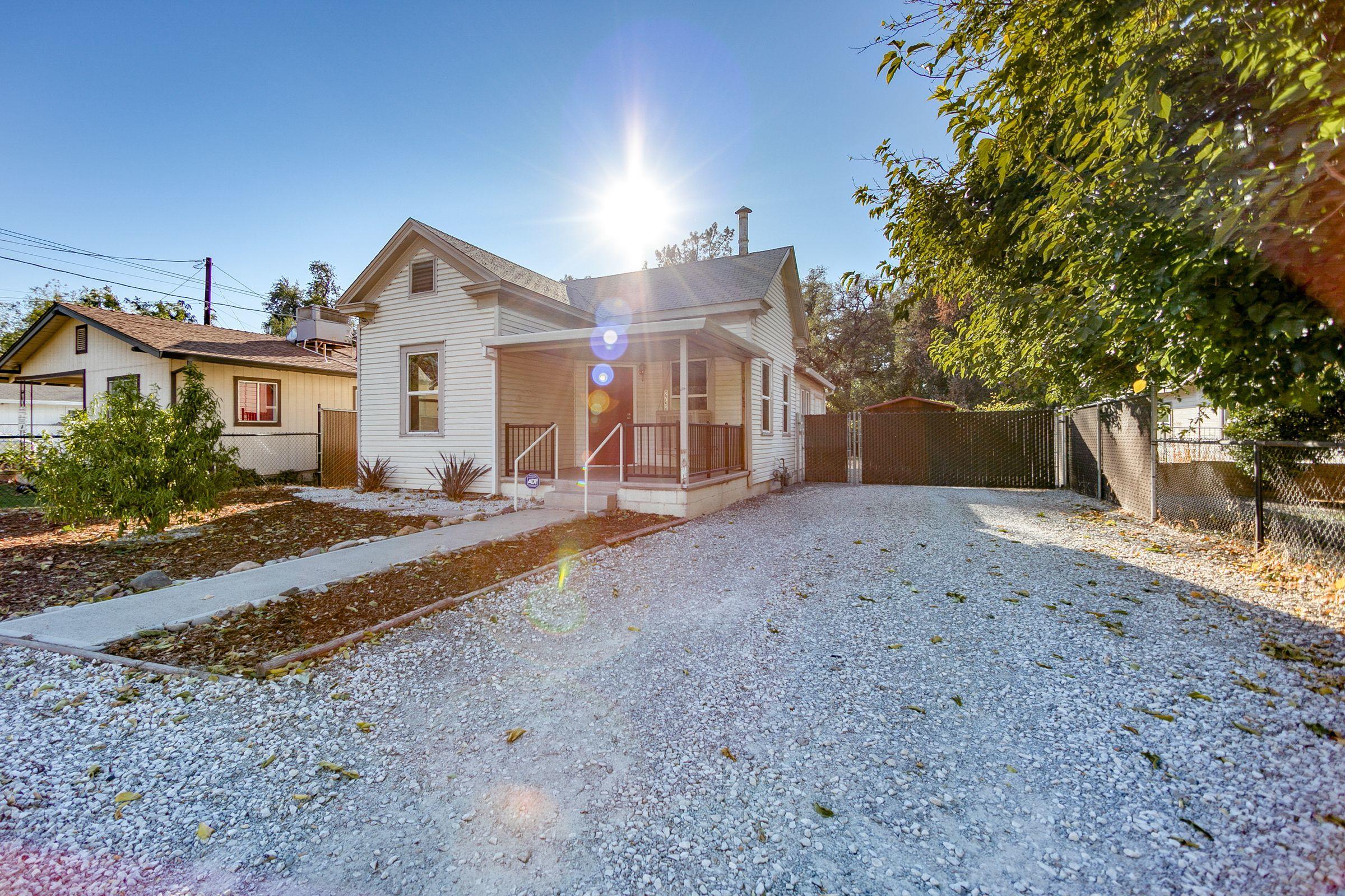 2756 Henderson Road Redding, CA 96002 - Photo 2 of 13 a view of a house with a yard and large tree