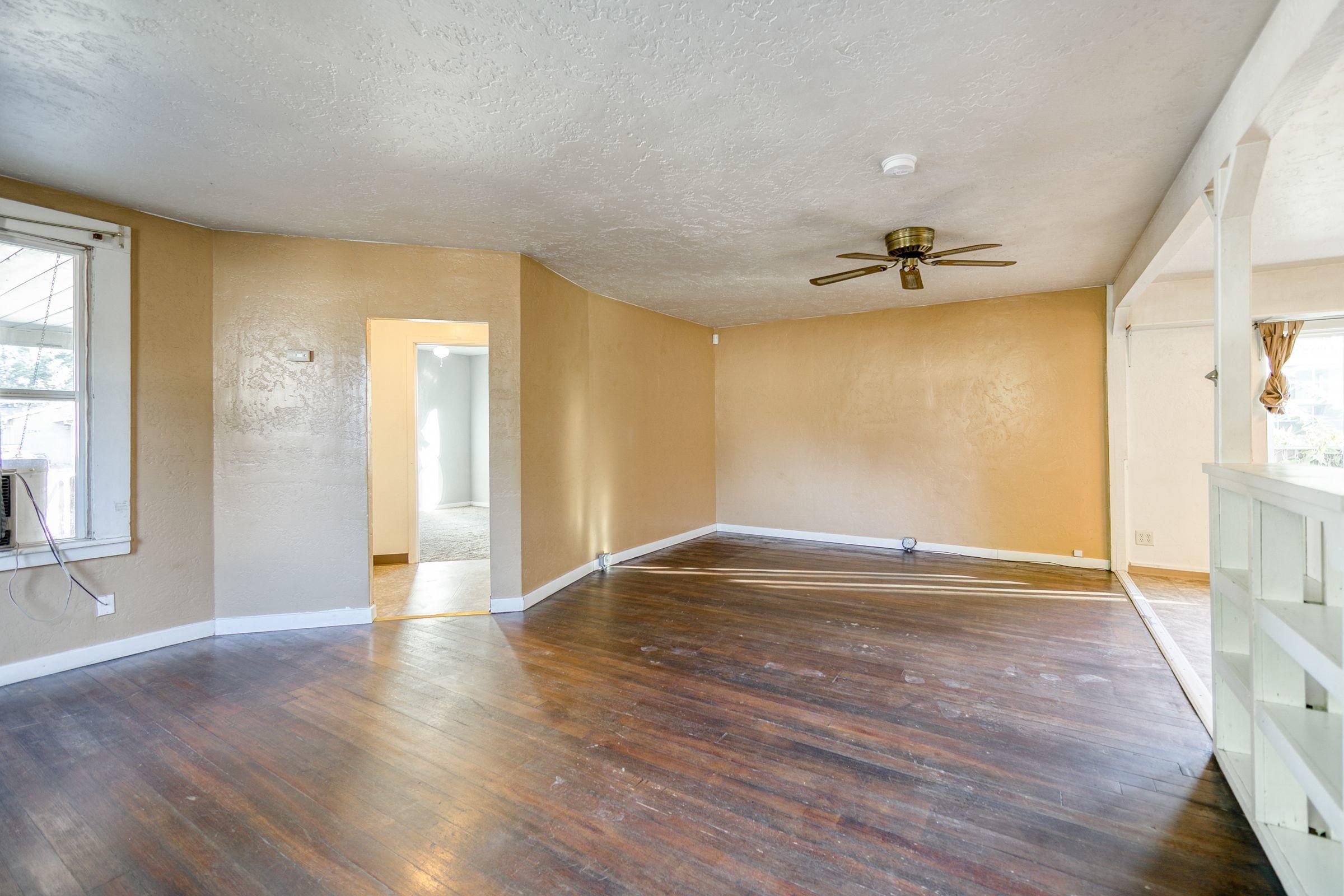 2756 Henderson Road Redding, CA 96002 - Photo 4 of 13 a view of empty room with wooden floor and fan