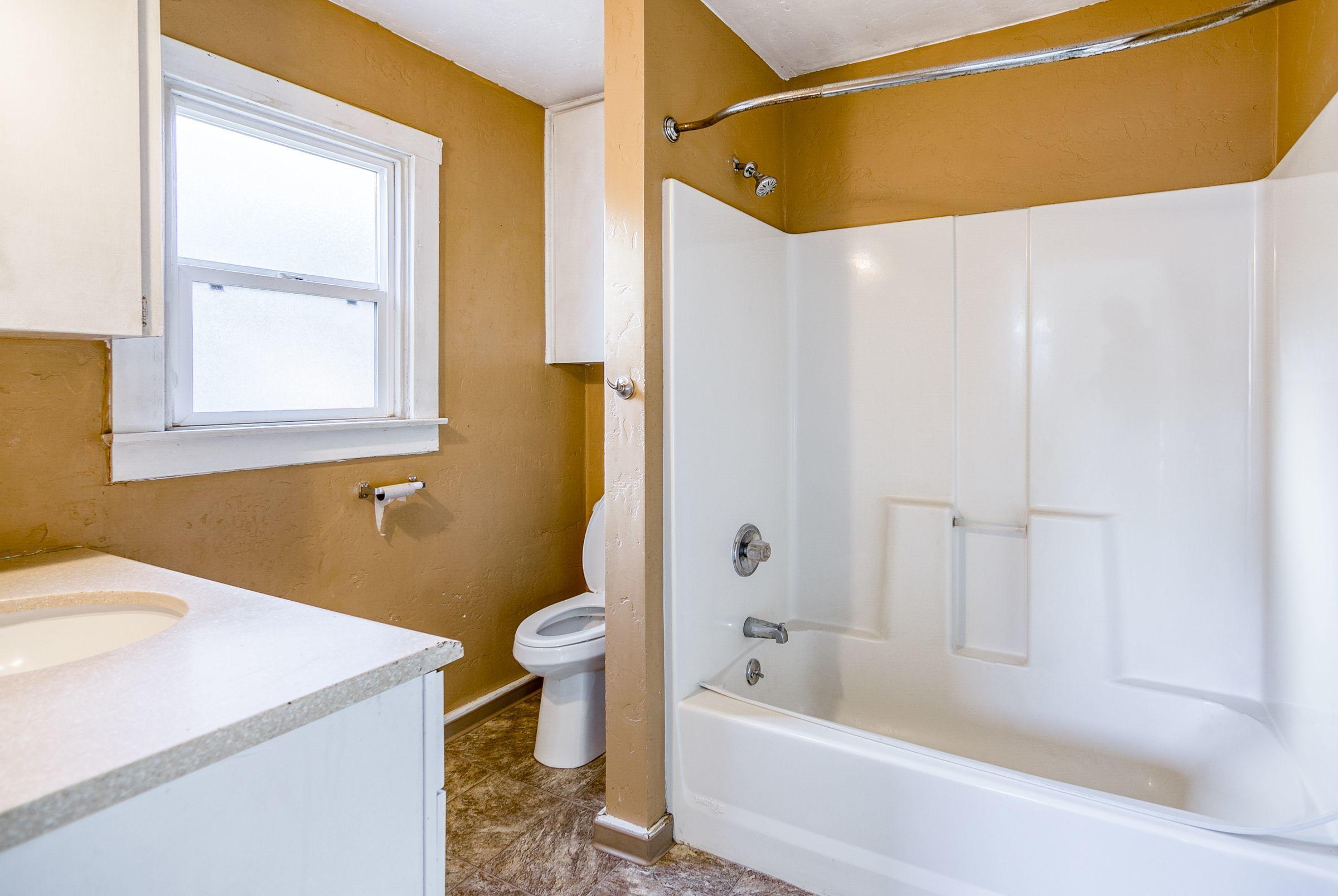 2756 Henderson Road Redding, CA 96002 - Photo 8 of 13 a bathroom with a sink a toilet and shower