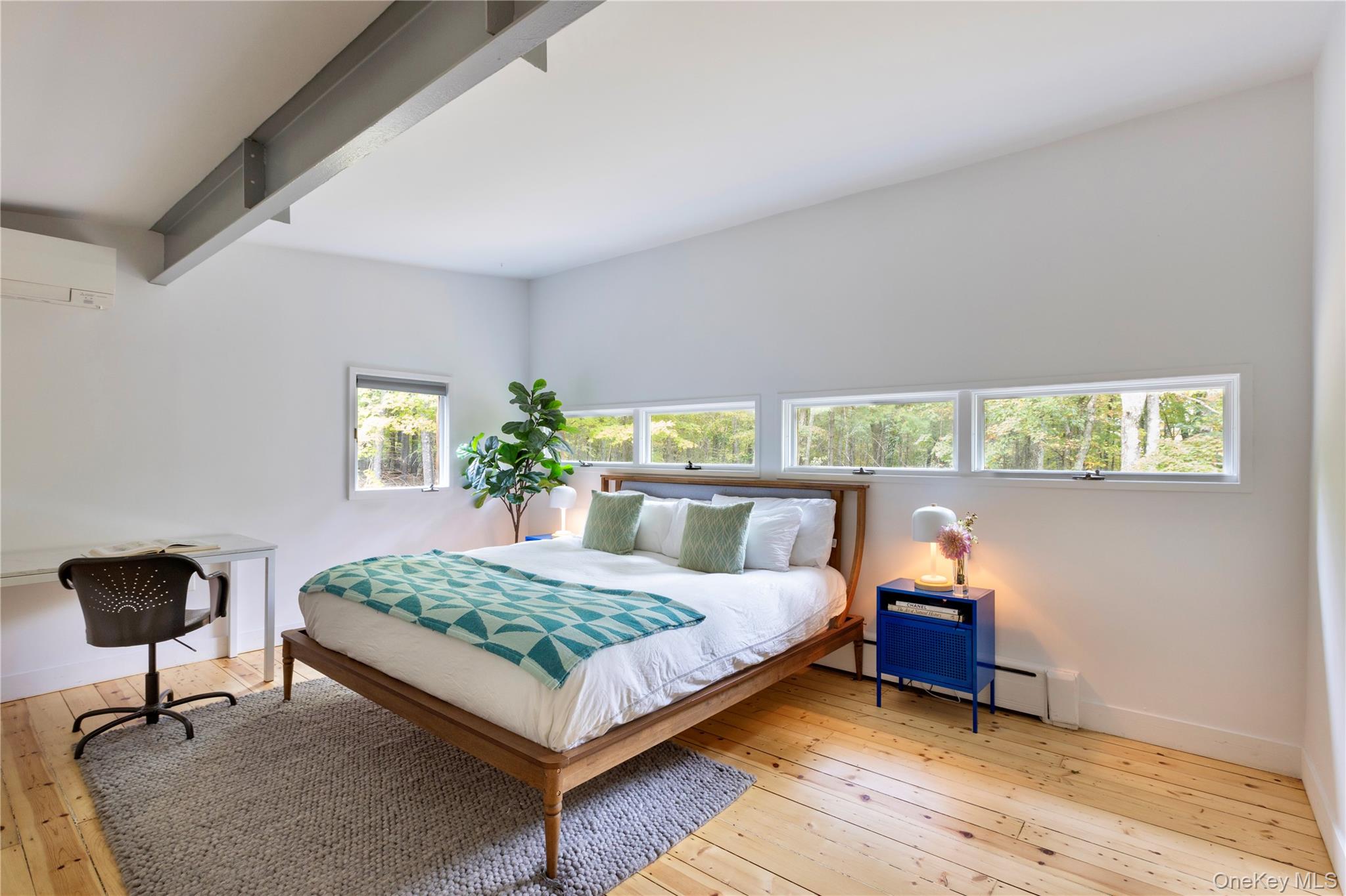 39 Hornbeck Road Accord, NY 12404 - Photo 12 of 24 Bedroom featuring light wood-type flooring, an AC wall unit, a baseboard heating unit, beam ceiling, and a desk