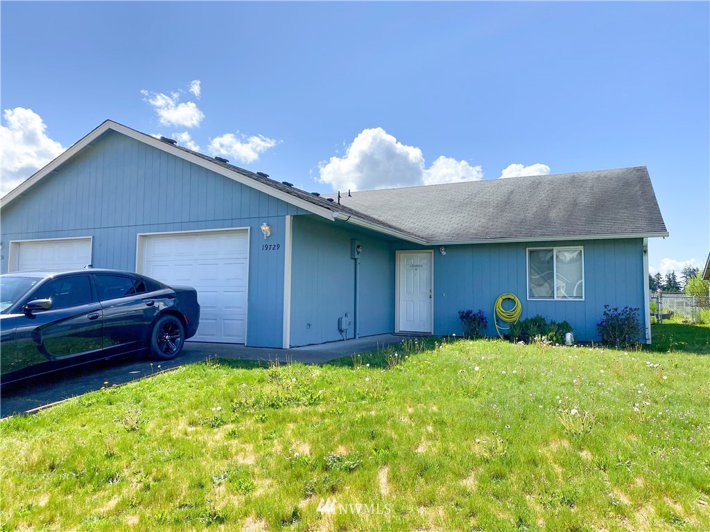 19729 Isabella Lane Southwest Rochester, WA 98579 - Photo 2 of 13 a view of a house with a backyard and sitting area