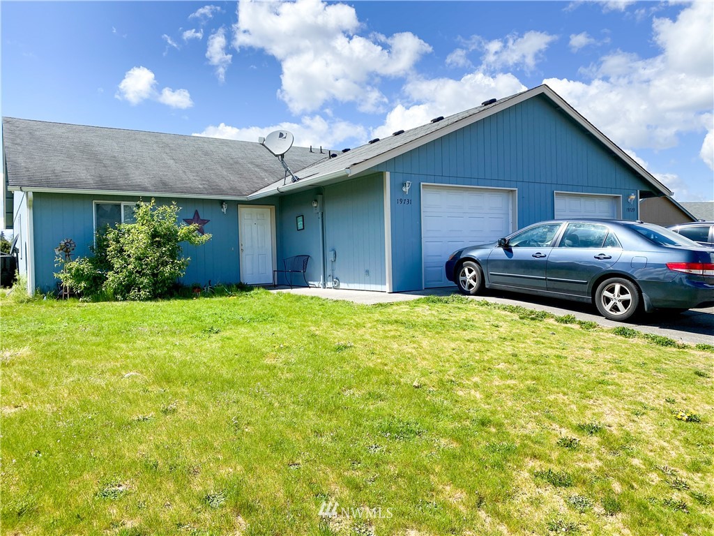 19729 Isabella Lane Southwest Rochester, WA 98579 - Photo 3 of 13 a front view of a house with garden