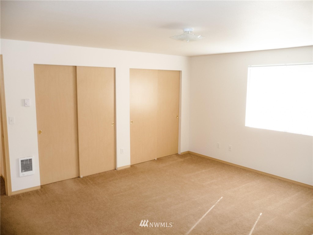 19729 Isabella Lane Southwest Rochester, WA 98579 - Photo 8 of 13 an empty room with windows