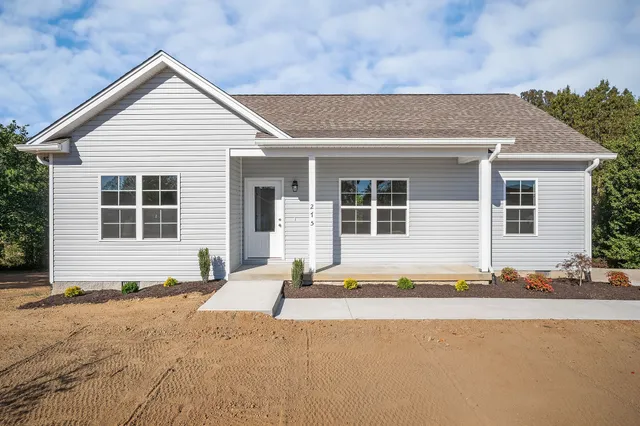 a front view of a house with a outdoor space