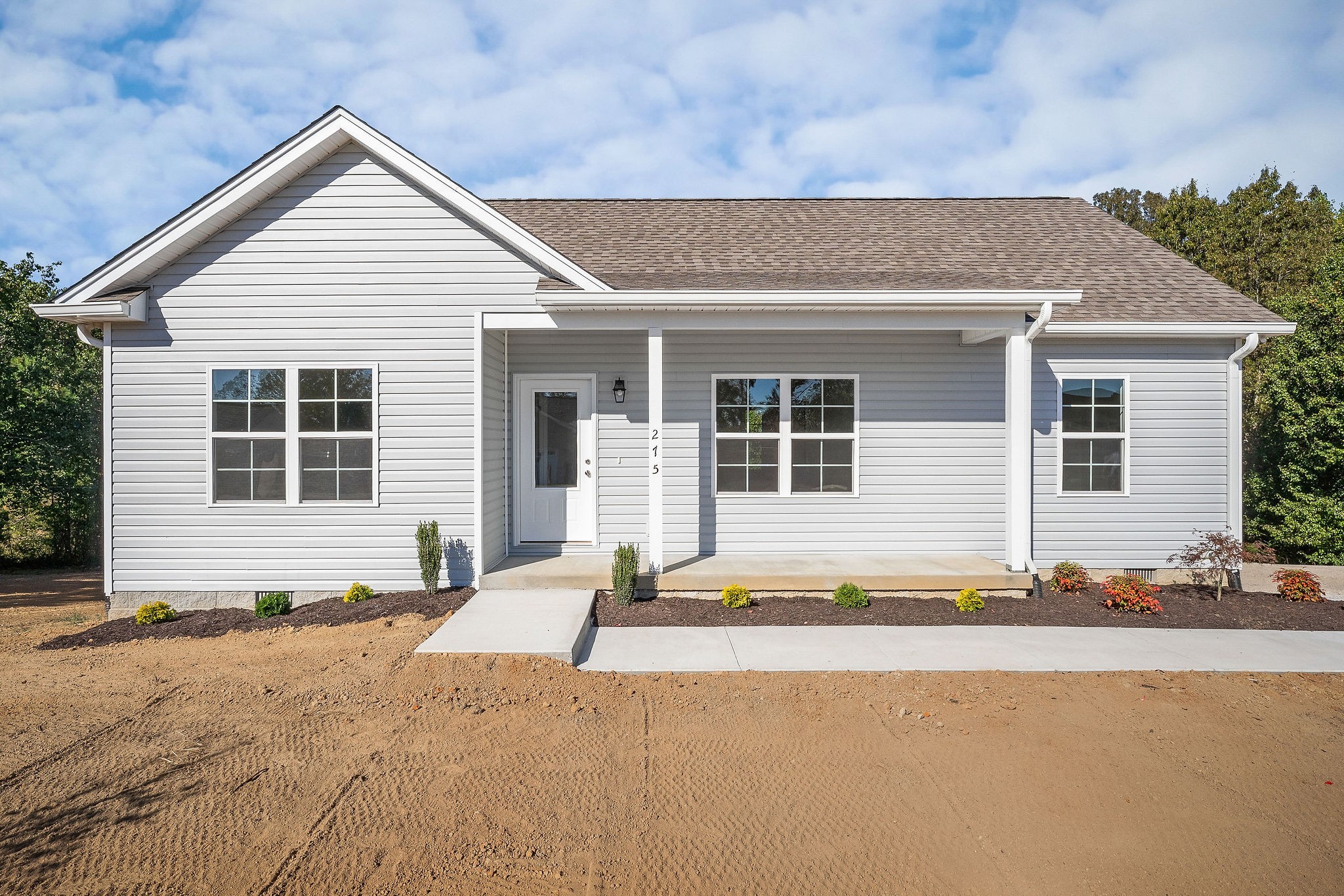 a front view of a house with a outdoor space